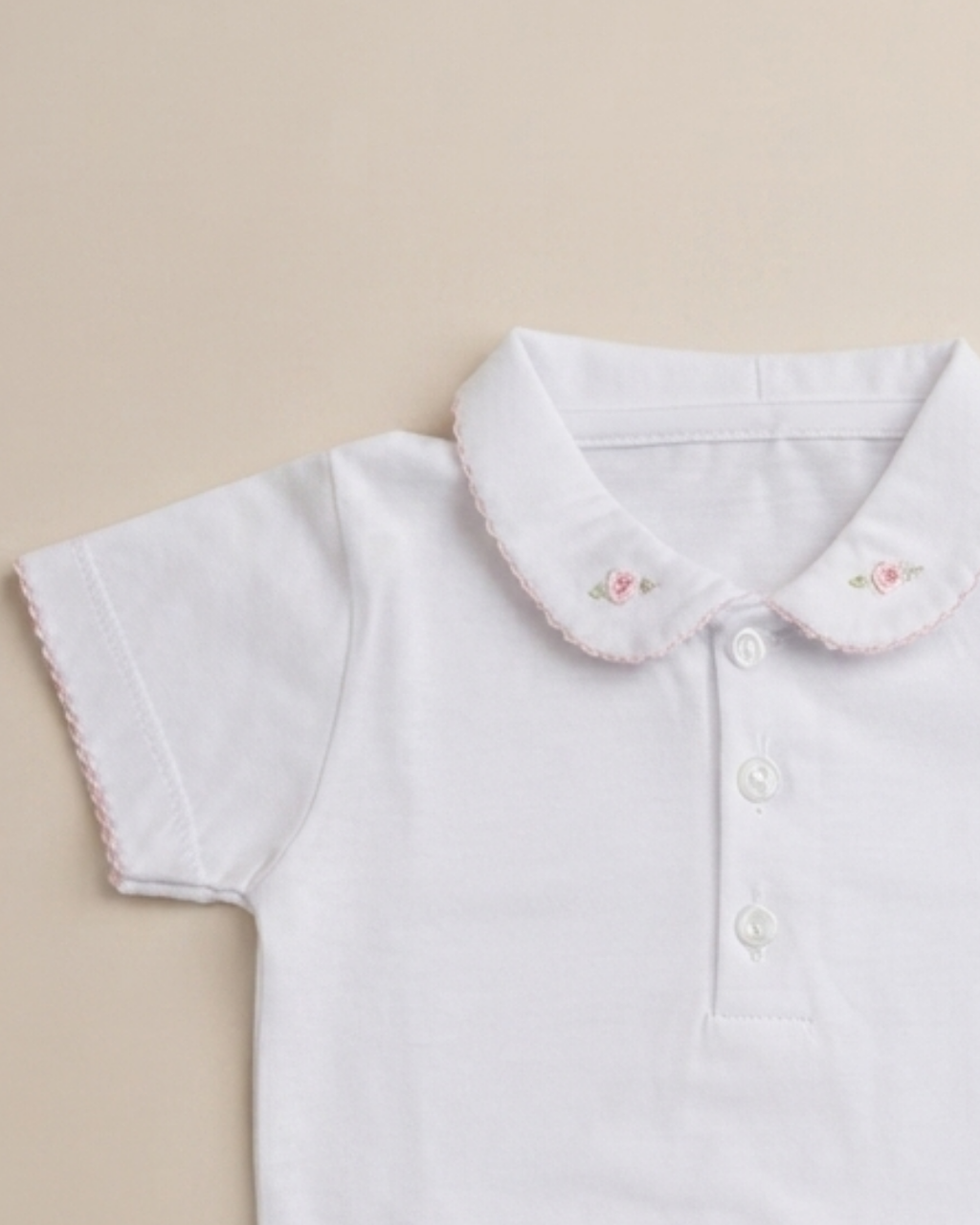 Body 100% algodón pima cuello flor bordada